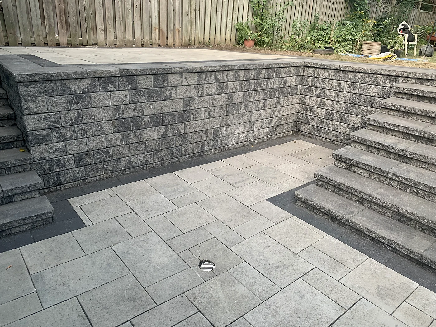 Completed retaining wall, steps, and grade transition by XY Landscaping