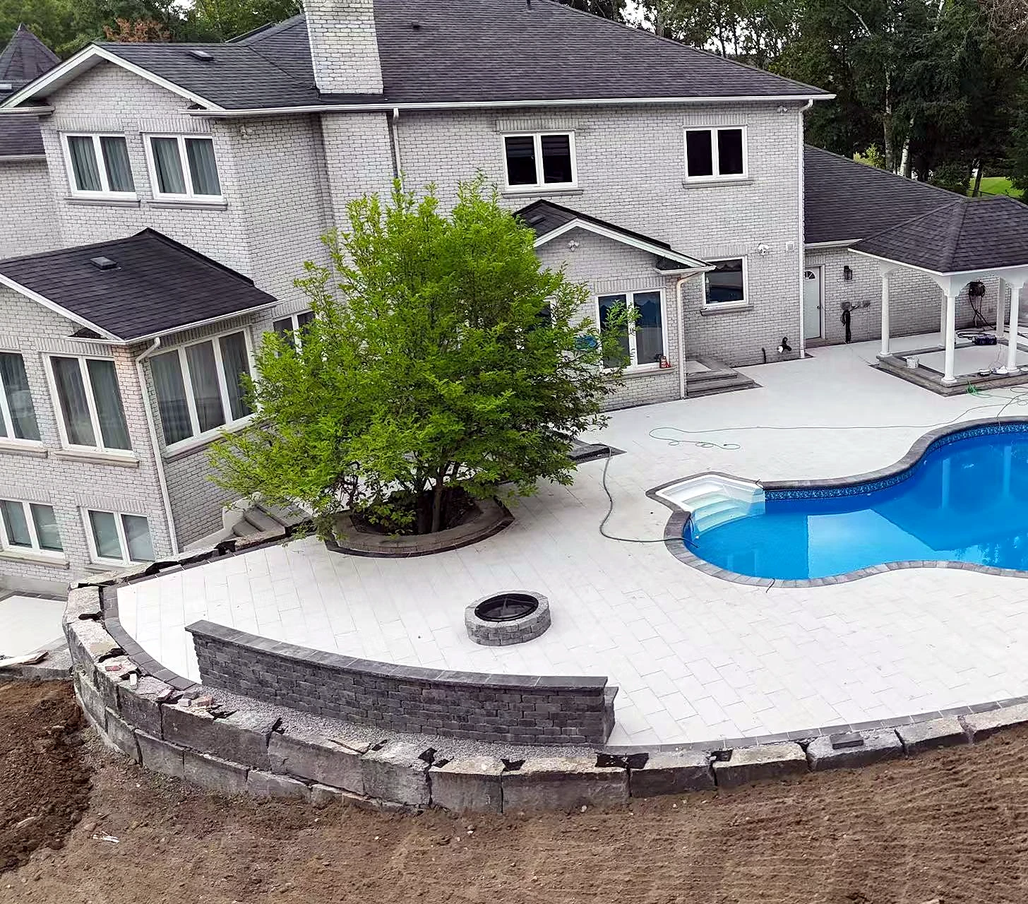 Poolside Interlock Patio & Retaining Edge · Construction Stage
